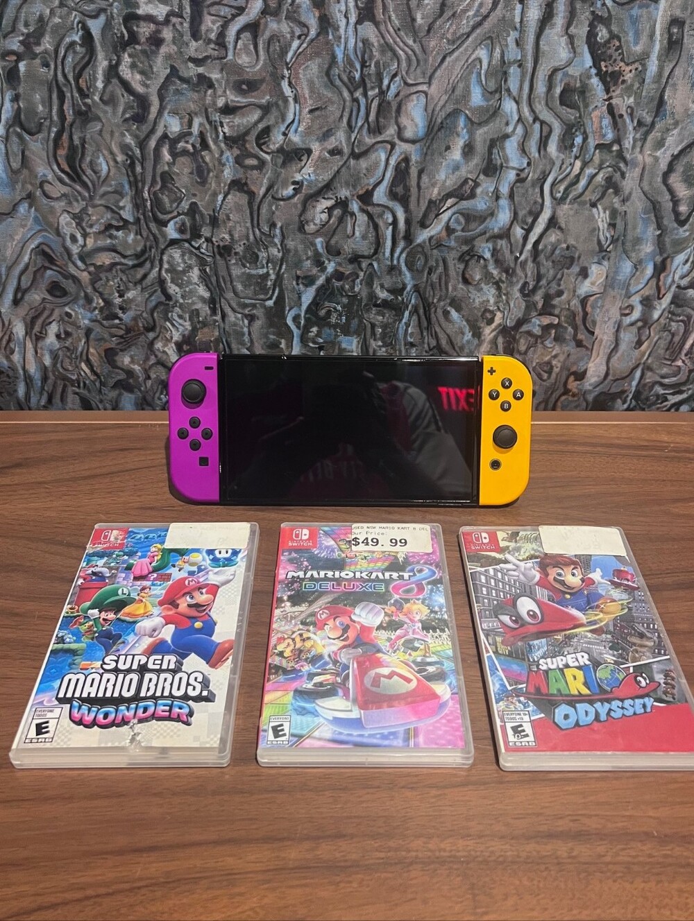 Nintendo Console with Purple & Yellow Joy‑Con Controllers And Mario Game Bundle